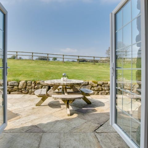 Enjoy your morning coffee out on the patio terrace overlooking the surrounding fields