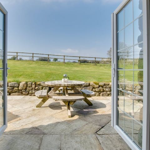 Enjoy your morning coffee out on the patio terrace overlooking the surrounding fields