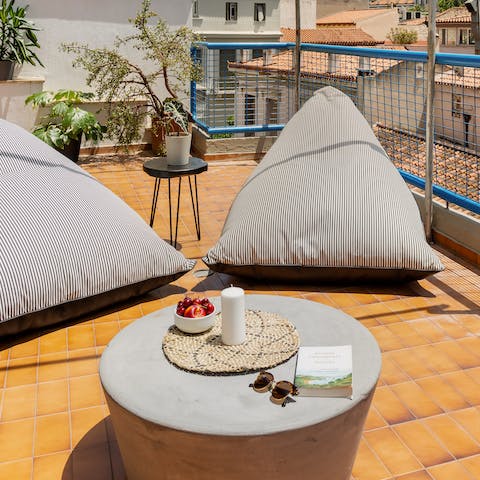 Dive into a good read while you soak in views of Athens