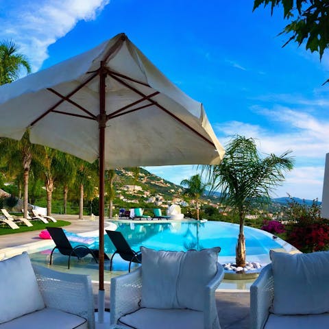 Chill out with an ice-cold drink on the poolside patio