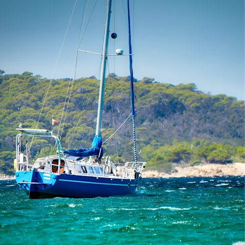 Spend your day exploring the island's bays by boat