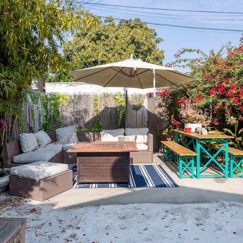 Relax with a drink in the sunlit garden after a day of in the city