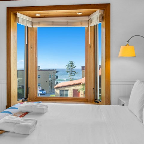Enjoy a glimpse of the ocean from the bay windows