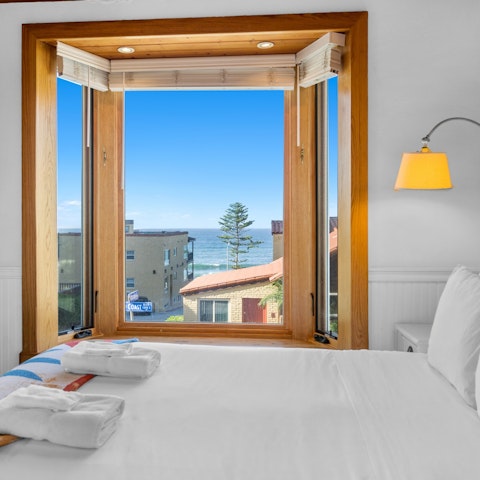 Enjoy a glimpse of the ocean from the bay windows
