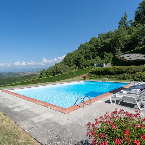Catch some rays around the private pool as you look out to idyllic views