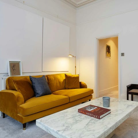 Curl up on the gold-hued sofa for a nightcap