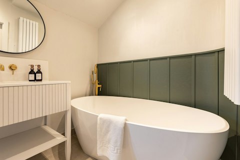 Soak in the freestanding bathtub after a day exploring the city on foot
