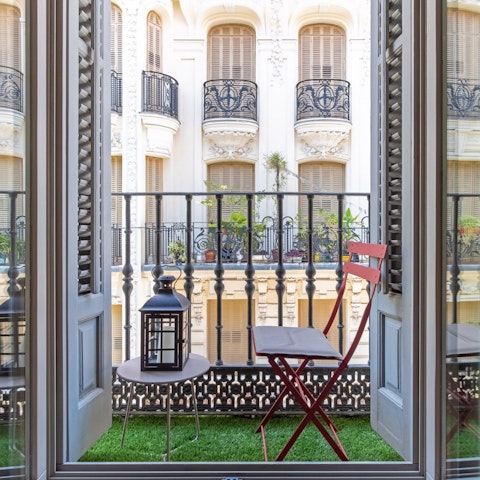 Enjoy a tinto de verano (or two) on the balcony