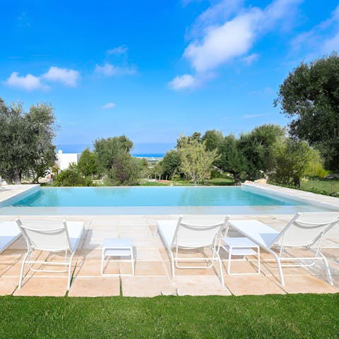Soak up that vitamin D by the private pool with gorgeous views