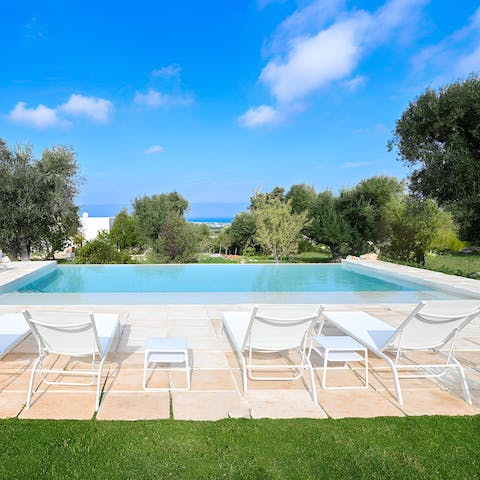 Soak up that vitamin D by the private pool with gorgeous views