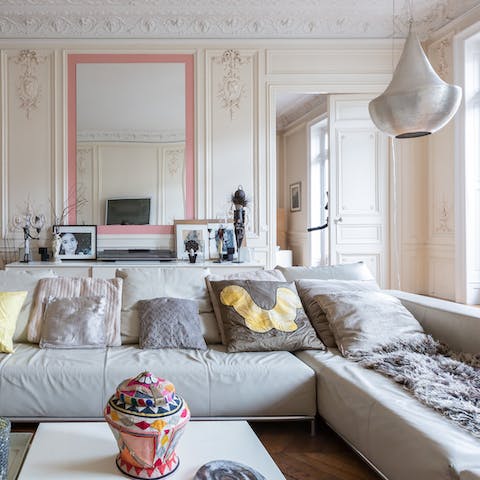 Curl up on the plush L-shaped sofa and admire the stunning period features