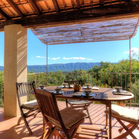 Enjoy your breakfast outdoors with mountain scenery ahead