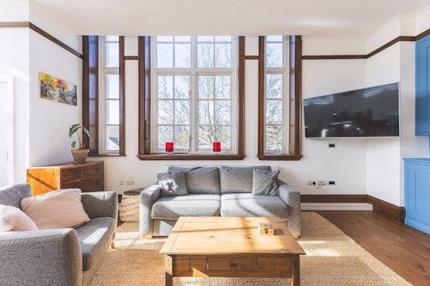 Settle into the bright living room as afternoon light pours in