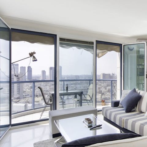 Sip your morning coffee with city views on the rooftop terrace