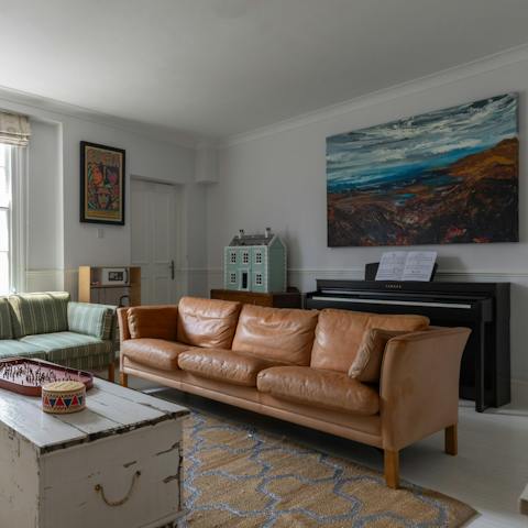Play a tune or two on the piano in one of the sitting rooms