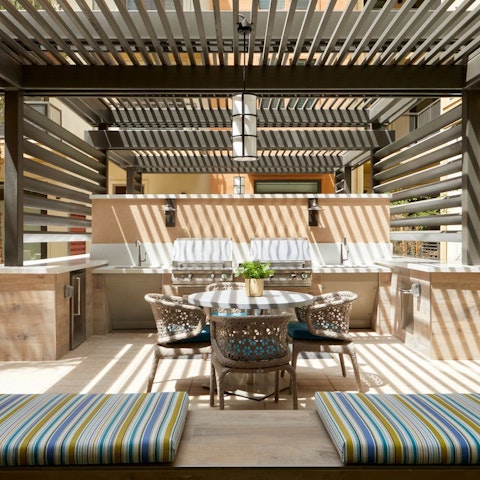 Make use of one of the communal grill stations for an alfresco meal by the pool