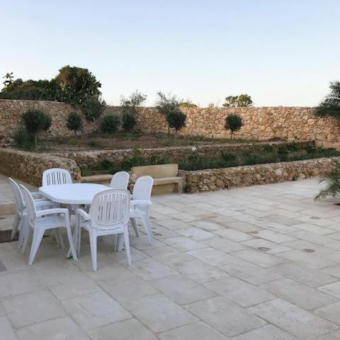 Fire up the barbecue and dine alfresco in your tranquil garden