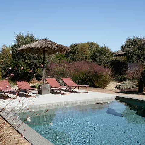 Take a seat by the pool and soak up the sun