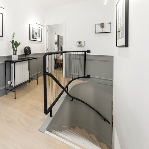 Descend the stairs through your stylish hallway as you head out to dinner