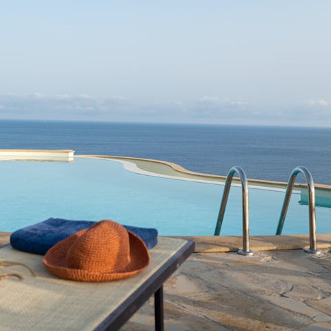 Swim in the infinity pool on a sunny afternoon