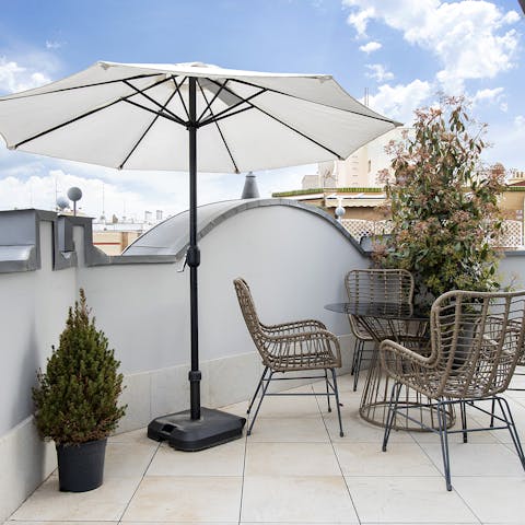 Relax on the private terrace and enjoy drinks and city views
