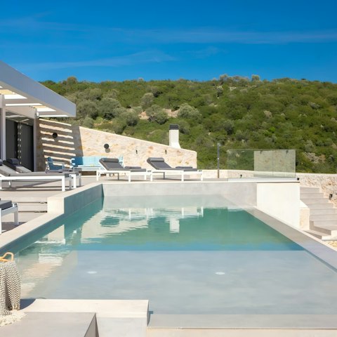 Spend all day relaxing on a lounger by the private pool