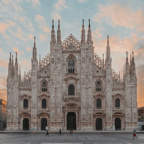 Visit Duomo di Milano – an eighteen-minute bus ride away