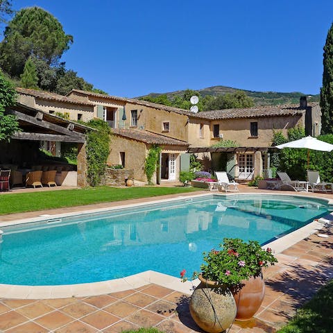 Spend lazy days by the pool sipping ice-cold beverages and soaking up the sun