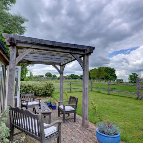 Relax on the patio with a book and a glass of wine
