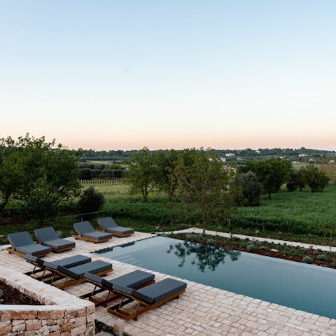 Swim in the infinity pool while admiring the view