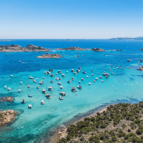 Admire Sardinia's spectacular seascape and watch the boats sail the ocean