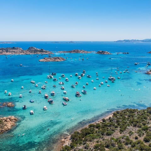Admire Sardinia's spectacular seascape and watch the boats sail the ocean