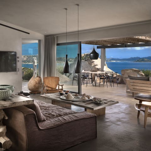 Snuggle on the sofa before strolling out and soaking up the panoramic sea view