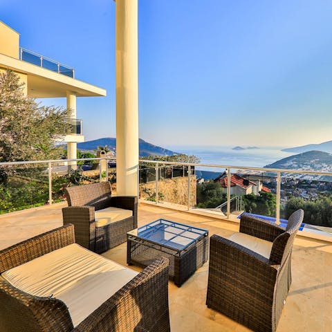 Share a few glasses of raki on the cushioned seats on the terrace