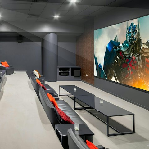 Catch a film in the communal movie theatre