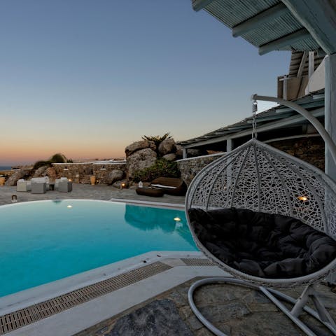Spend your evenings poolside in the stylish egg chair