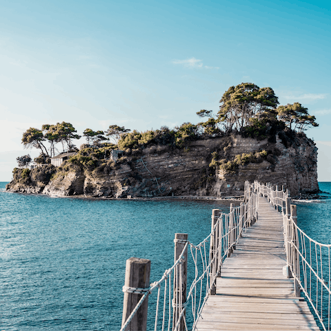 Cross over the wooden walkway to Cameo Island beach bar