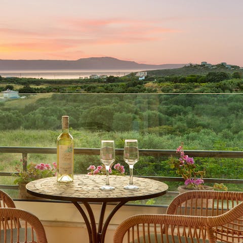 Toast to your well-deserved holiday out on the balcony