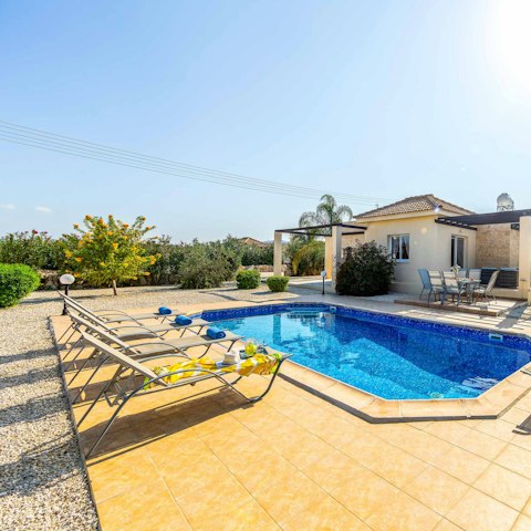 Sunbathe before slipping into the crystalline waters of the private pool