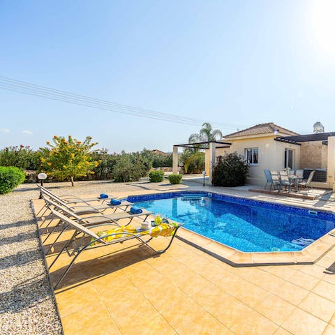 Sunbathe before slipping into the crystalline waters of the private pool