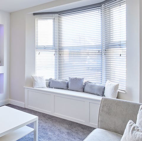 Curl up in the sun-drenched window seat with a glass of wine and a good book