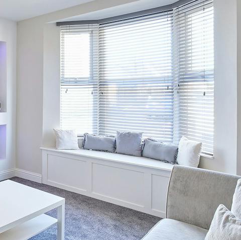 Curl up in the sun-drenched window seat with a glass of wine and a good book