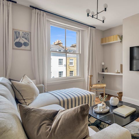 After a busy day in London, relax on the chaise sofa