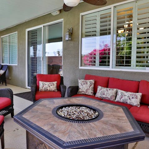 Gather around the fire pit table of an evening