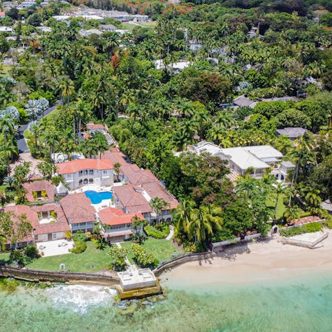 Stroll through the tropical garden to reach the sandy Alleynes Bay and swim in the Caribbean Sea