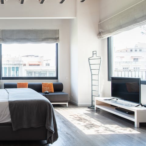 Let the natural light flood in from the huge windows in the master bedroom