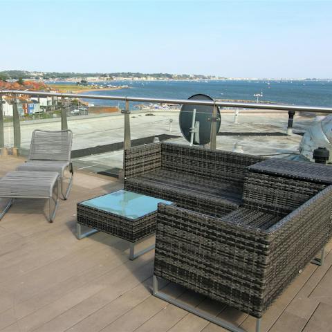 Admire the amazing views over the harbour towards Sandbanks