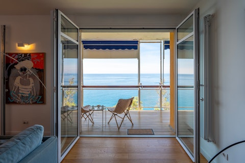Step onto the balcony above an expanse of open sea