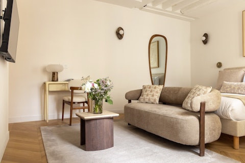 Settle into a serene Le Marais studio with curated neutral decor