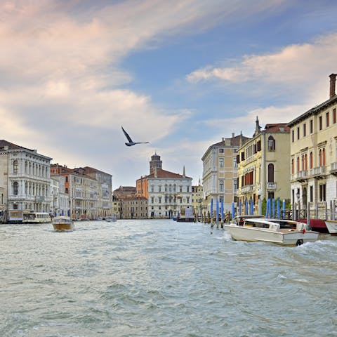 Head out for cocktails at sunset, like a bellini at the iconic Harry's Bar